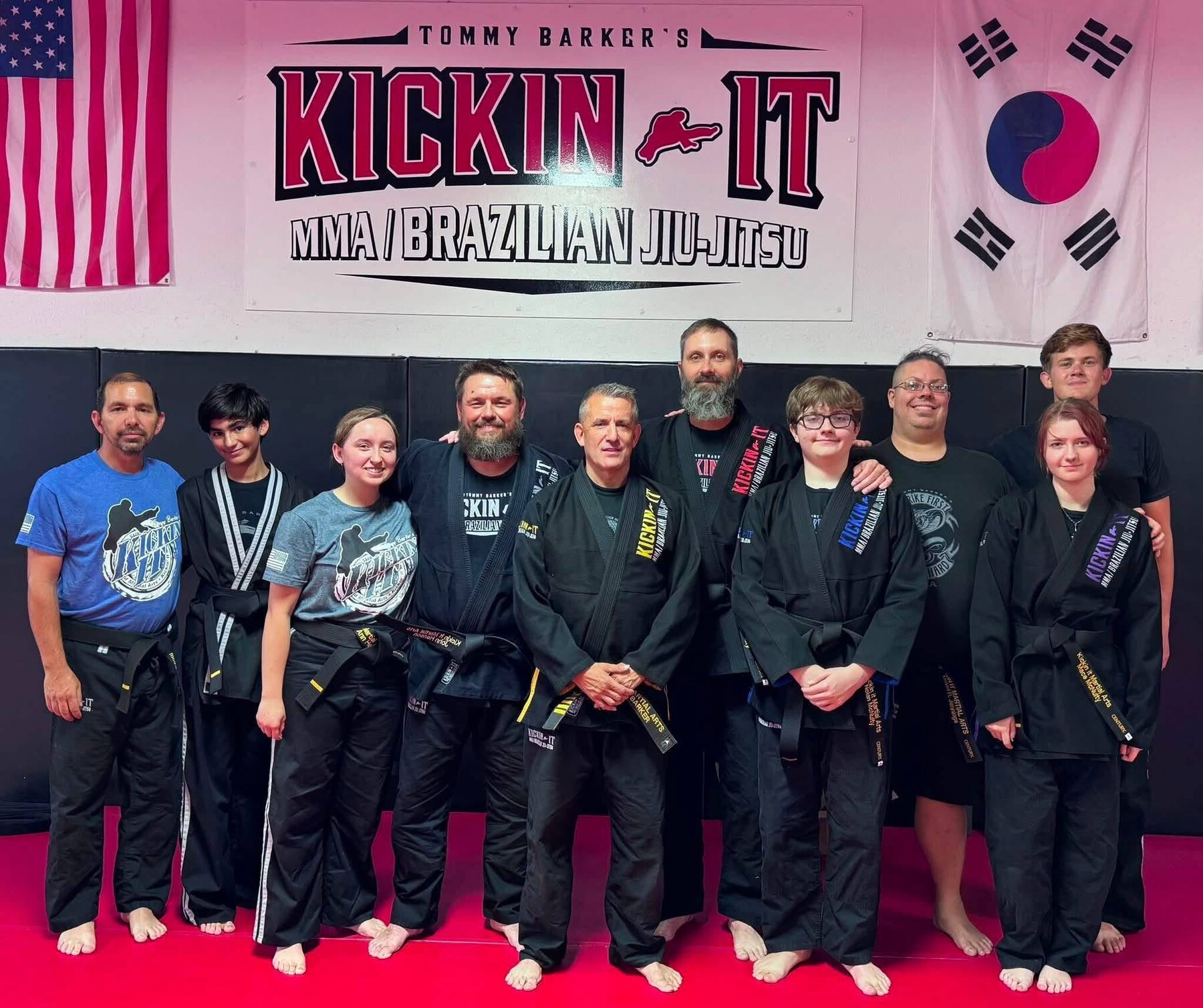 Kickin It black belt team at the academy